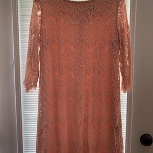 Very nice lace overlay dress.  Pale pink